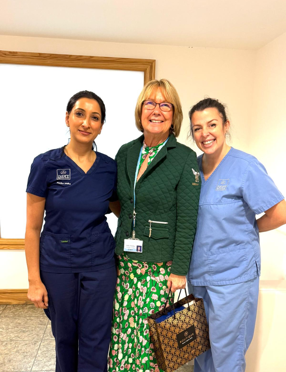 Dr Monika photo after surgery with patient and dental nurse